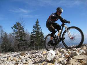 Climbing in the Jura on a borrowed fully.