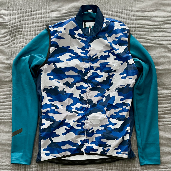 Camouflage printed vest and ink blue jersey.